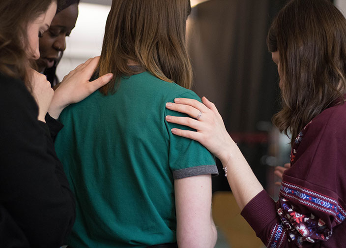 20181204-ministries-bodyimage-women-gathered-together-to-pray-over-a-friend