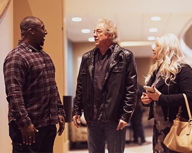 People talking in the church foyer