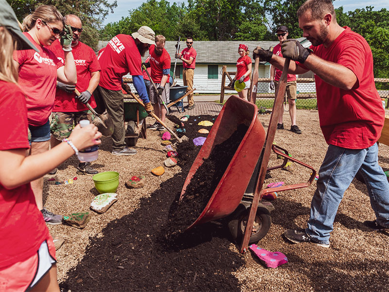 Volunteers participating in an outdoor Serve Day project
